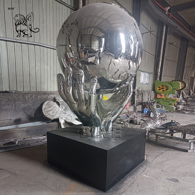 Stainless Steel Holding Earth Sculpture Large Mirror Polished Metal World Globe Statues Decoration Outdoor Square Custom