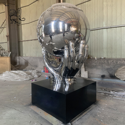 Stainless Steel Holding Earth Sculpture Large Mirror Polished Metal World Globe Statues Decoration Outdoor Square Custom