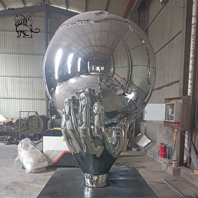 Stainless Steel Holding Earth Sculpture Large Mirror Polished Metal World Globe Statues Decoration Outdoor Square Custom